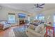 Comfortable living room with a fireplace, ample seating and a view to the dining room at 4462 Francis Yonge Way, Hollywood, SC 29449