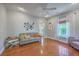 Comfortable living room featuring hardwood floors, neutral tones, and ample natural light at 4462 Francis Yonge Way, Hollywood, SC 29449