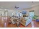 Bright living room boasts hardwood floors, a fireplace, and comfortable seating at 4462 Francis Yonge Way, Hollywood, SC 29449