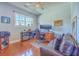 Functional home office with a desk, comfortable seating, and hardwood floors at 4462 Francis Yonge Way, Hollywood, SC 29449