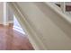 Close-up of painted staircase with wood flooring at 4462 Francis Yonge Way, Hollywood, SC 29449