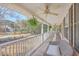 Relaxing porch with wicker furniture and hanging ferns, perfect for outdoor enjoyment at 4462 Francis Yonge Way, Hollywood, SC 29449