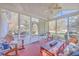 A beautiful screened porch provides comfortable seating with a view of the backyard at 4462 Francis Yonge Way, Hollywood, SC 29449