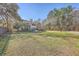 Large backyard with expansive lawn and mature trees at 4462 Francis Yonge Way, Hollywood, SC 29449