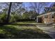 Expansive backyard featuring a well-maintained lawn and a small patio, ideal for outdoor enjoyment at 5468 W Lakeland Dr, North Charleston, SC 29406