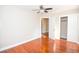 Bedroom featuring wood floors, closet, and two windows at 5468 W Lakeland Dr, North Charleston, SC 29406