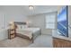 Cozy bedroom featuring a queen-size bed, side tables with lamps and a mounted flat screen television at 667 Black Pine Rd, Moncks Corner, SC 29461