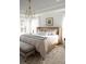 Spacious bedroom featuring a large bed, sitting bench and natural light at 707 Alma Square Dr, Moncks Corner, SC 29461