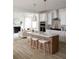 Beautiful kitchen with a large island, white cabinets, and stylish pendant lighting at 707 Alma Square Dr, Moncks Corner, SC 29461