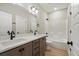 Bathroom featuring a double vanity, large mirror, and shower-tub combo at 709 Oakridge View Trl, Ridgeville, SC 29472
