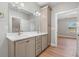 Bright bathroom features double sink vanity, wood floors, and neutral paint at 709 Oakridge View Trl, Ridgeville, SC 29472