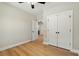 Bright bedroom featuring hardwood floors, and a closet with views of the home's interior at 709 Oakridge View Trl, Ridgeville, SC 29472