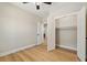 Bright bedroom with hardwood floors, a closet, and access to the home's interior at 709 Oakridge View Trl, Ridgeville, SC 29472