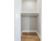 Empty closet space with wood floor and hanging rod at 709 Oakridge View Trl, Ridgeville, SC 29472