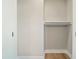 Closet with built-in shelving and hardwood floors provides ample storage space at 709 Oakridge View Trl, Ridgeville, SC 29472