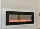 Modern fireplace featuring sleek black trim and realistic flames, adding warmth to the space at 709 Oakridge View Trl, Ridgeville, SC 29472