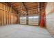 Spacious two car garage with unfinished walls and ceiling and two doors at 709 Oakridge View Trl, Ridgeville, SC 29472