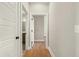 Hallway features hardwood floors with doors leading to the bathroom and other rooms at 709 Oakridge View Trl, Ridgeville, SC 29472