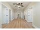 Hallway features hardwood floors, multiple doorways, and recessed lighting at 709 Oakridge View Trl, Ridgeville, SC 29472