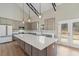 Stylish kitchen with a large center island, stainless steel appliances, and open layout at 709 Oakridge View Trl, Ridgeville, SC 29472
