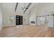 Spacious living room with high ceilings, a modern fireplace, and sleek sliding barn doors at 709 Oakridge View Trl, Ridgeville, SC 29472