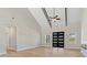 Open living room with vaulted ceilings, fireplace and large windows flood the space with sunlight at 709 Oakridge View Trl, Ridgeville, SC 29472