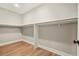 Walk-in closet offers hardwood floors and plenty of space for clothes storage at 709 Oakridge View Trl, Ridgeville, SC 29472