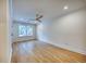 A clean bedroom features hardwood floors, bright window and ceiling fan at 841 Fred St, Charleston, SC 29412