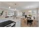 Bright kitchen featuring white cabinets, granite countertops, stainless appliances, with views to the dining and living areas at 8476 Old Georgetown Rd, McClellanville, SC 29458