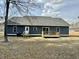 Exterior backyard of home featuring wooden deck and blue siding at 85 Prestwick Pl, Walterboro, SC 29488