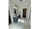 Well-appointed bathroom featuring a modern vanity, access to a walk-in closet, and a toilet room at 85 Prestwick Pl, Walterboro, SC 29488