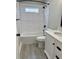 Modern bathroom featuring white subway tile in shower, grey tile floors, and sleek fixtures at 85 Prestwick Pl, Walterboro, SC 29488