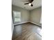 Inviting bedroom with natural light, wood flooring, and ceiling fan at 85 Prestwick Pl, Walterboro, SC 29488
