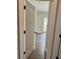 An interior view of a bedroom with wood-look flooring, light-colored walls, and a window at 85 Prestwick Pl, Walterboro, SC 29488
