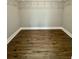 Spacious walk-in closet featuring wood-look floors and ample shelving for storage at 85 Prestwick Pl, Walterboro, SC 29488