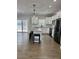 Modern kitchen featuring white cabinets, stainless steel appliances, and an island with stool seating at 85 Prestwick Pl, Walterboro, SC 29488