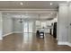 Spacious open-concept living room with hardwood floors and a view into the kitchen at 85 Prestwick Pl, Walterboro, SC 29488