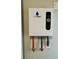 EcoSmart tankless water heater with digital display and color-coded water lines at 85 Prestwick Pl, Walterboro, SC 29488