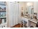 Bathroom featuring a vanity with granite countertop, built-in storage, and a mirror at 874 Law Ln, Mount Pleasant, SC 29464