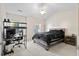 Spacious bedroom with vaulted ceiling, ceiling fan, large bed, and a gaming setup at 8741 Grassy Oak Trl, North Charleston, SC 29420