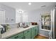 Inviting kitchen with stainless steel refrigerator, ample countertop space and a window to the outdoors at 8741 Grassy Oak Trl, North Charleston, SC 29420