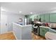 Well-lit kitchen featuring stainless steel appliances, abundant counter space and green cabinets at 8741 Grassy Oak Trl, North Charleston, SC 29420