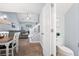 Inviting living area featuring an open staircase, a comfortable seating area, and a convenient half bath at 8741 Grassy Oak Trl, North Charleston, SC 29420
