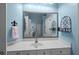 Bathroom featuring a large mirror, white vanity, and light blue walls at 9394 Harroway Rd, Summerville, SC 29485