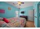 Bedroom with a queen-size bed and a window overlooking the backyard at 9394 Harroway Rd, Summerville, SC 29485