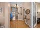 Elegant foyer with hardwood floors, arched doorways, decorative lighting, and stylish accents at 9394 Harroway Rd, Summerville, SC 29485
