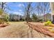 Expansive backyard with lush greenery, mature trees, and well-maintained landscaping offers privacy and space at 1032 Black Rush Cir, Mount Pleasant, SC 29466