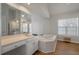 Luxurious bathroom featuring a soaking tub, a vanity with double sinks, and bright natural light at 1032 Black Rush Cir, Mount Pleasant, SC 29466