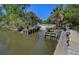 Picturesque boat ramp providing access to the calm water, surrounded by lush greenery and trees at 1032 Black Rush Cir, Mount Pleasant, SC 29466