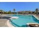Expansive community pool area showcasing ample seating, clear blue water, and meticulous landscaping at 1032 Black Rush Cir, Mount Pleasant, SC 29466